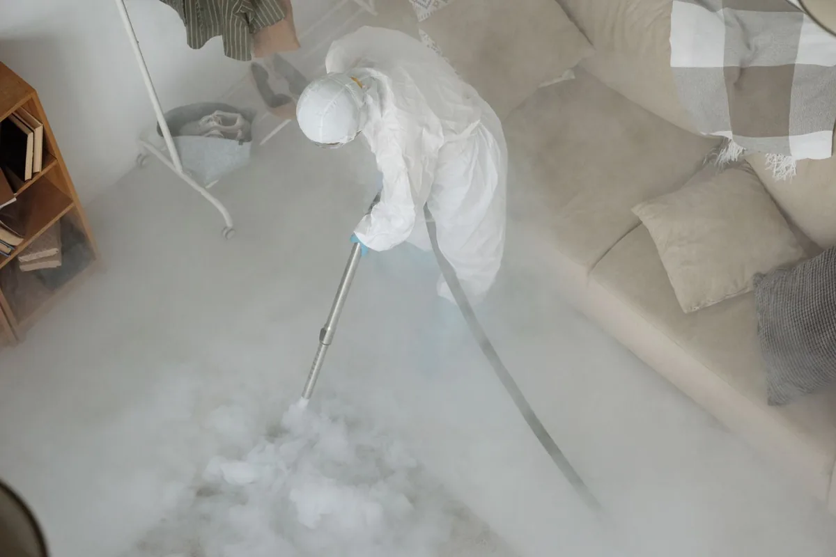 Biohazard cleanup technician in protective equipment, Wakefield, MA